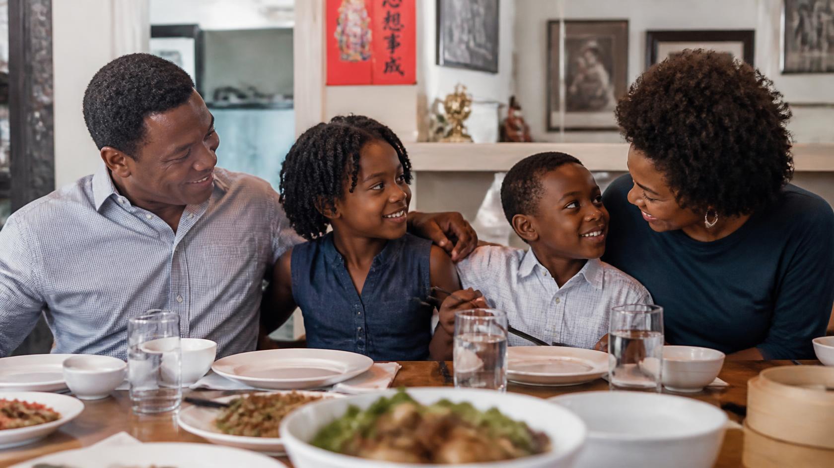 Illustrative family enjoying time together at the dining table